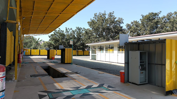 Image of a vehicle undergoing technical inspection in a modern facility